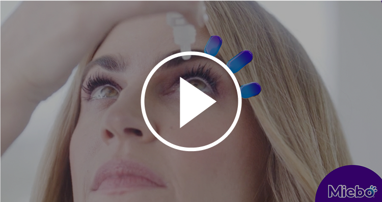 Woman applying Miebo eye drops to her eye. Click to play video.