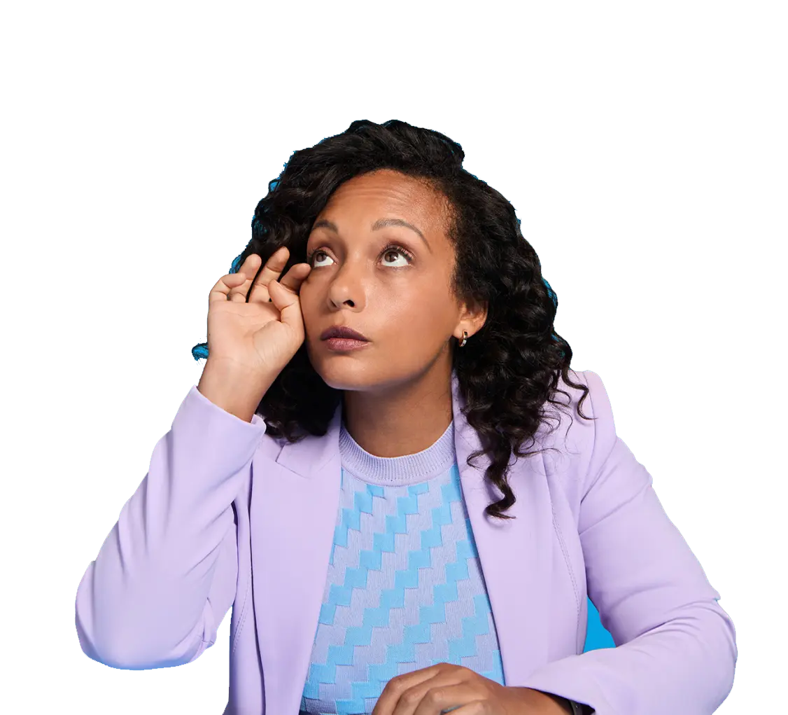 A woman looking up and rubbing her right eye